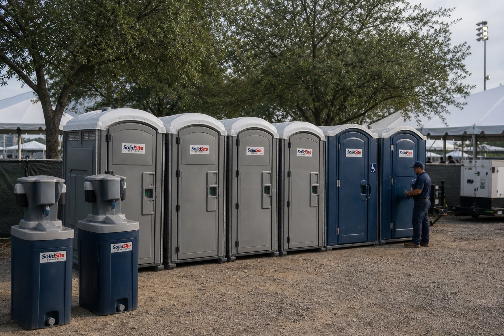 SolidSite branded portable restrooms and hand-wash stations prepared for an event